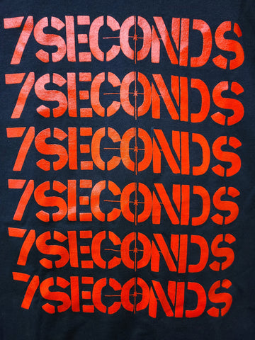 7 Seconds logo red print  stacked vertically 6 times on black tee