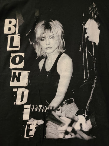 black tee with white print Blondie live on stage and says Blondie in block letters