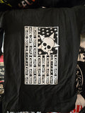 Black t-shirt with white graphic design featuring a skull and 'CRASH BANG BOOM' text on a flag background.