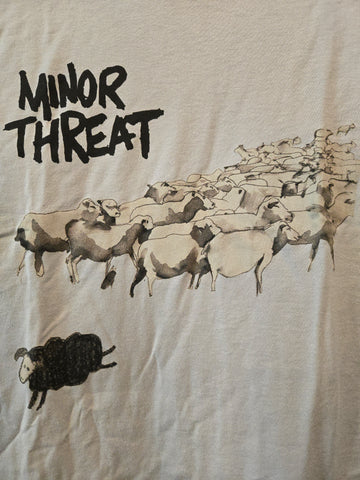 Light grey Minor Threat tshirt with black sheep amongst white sheep 