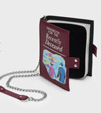 Licensed Beetlejuice book shaped novelty handbag with text Handbook for the Recently Deceased with chain strap and snap closure