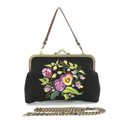 black cotton lines kiss lock bag with embroidered purple and yellow pansies