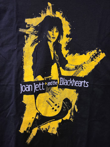 Yellow print on black tee band name joan jett and the blackhearts and joan jett jumping with guitar