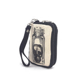 small canvas zippered wristlet with skull in jar print