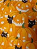 orange  jack o lanterns with and black kitties print glow in the dark