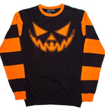 Black knit sweater with orange jack o lantern face and orange striped sleeves