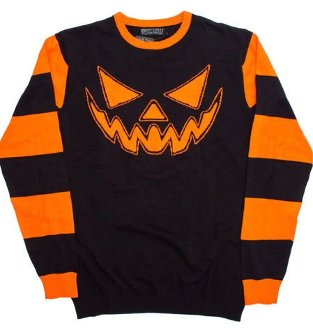 Black knit sweater with orange jack o lantern face and orange striped sleeves